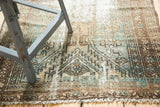 Vintage Malayer runner with geometric Herati motifs, softened green, bronze, and low pile texture.
