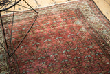 Vintage Malayer runner with repeating germinating flower design in madder red, powder blue, and beige border.