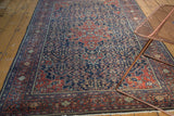 Finely woven vintage Farahan Sarouk rug, intricate madder root red and navy patterns.