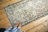 Vintage Hamadan runner with beige field, brown geometric motifs, and even knot wear.
