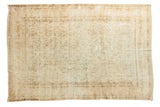 Hand-knotted vintage Kerman carpet with allover floral design in soft ivory, green, and blue.