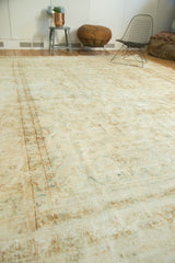 Vintage Kerman carpet featuring mostly even pile wear with faded ivory and beige floral vinery.