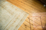 Vintage Kerman rug, allover intricate floral design with faded tendrils, showing end fringe.
