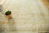 Vintage Kerman carpet with mostly even wear, allover floral pattern, and time-softened tones.