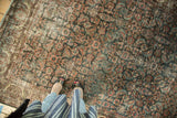 Vintage Mahal carpet, intricate Herati motif, worn pile revealing foundation, plum, indigo hues.