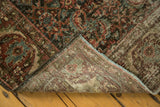 Mahal carpet's Herati motif, showing even pile wear, secured side, and hand-knotted reverse.