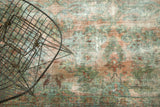 Vintage Lilihan carpet detail, showing etched foundation, faded raspberry and dusty teal floral motifs.