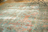 Faded raspberry and dusty teal allover floral bouquets with subtle asymmetry on a vintage Lilihan carpet.