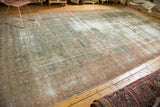 Antique Kerman carpet with evenly distressed sea foam green pile and visible restrung foundation.
