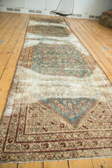 Antique Malayer runner corner with aqua blue-green floral, ivory border, and visible etching.