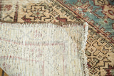 Antique Malayer rug foundation, secured edge, and patterned pile with visible knot heads.