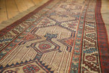 Antique Serab runner, geometric repeating medallions with serrated contours on natural camel field.