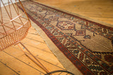 Natural camel hair selvage and deep wine red geometric border of an antique Serab runner.