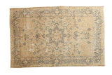 Hand-knotted vintage Meshed carpet with central starburst medallion and aged ivory, faded navy floral design.