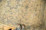 Antique ivory vintage Meshed rug with navy floral vinery and mil fleur border.