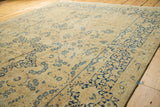 Delicate navy blue vinery and mil fleur border pattern on a vintage Meshed rug.