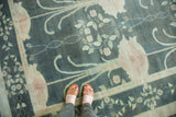 Vintage Indo Donegal carpet with Arts and Crafts teal, blush, and green floral pattern.