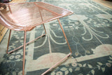 William Morris style floral motif in burnt teal and pale blush tones.