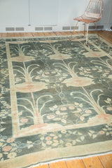 Arts and Crafts floral border and pale fringe on a vintage Indo Donegal carpet.