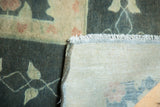 Vintage Indo Donegal carpet showing hand-knotted foundation, secured fringe, and Arts & Crafts pile.