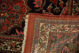 Vintage Bijar carpet's cherry red herati pile and finely woven European border reverse.