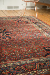 Detailed cherry brick red herati motif field with a navy blue European influenced corner.