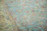 Close-up of distressed Persian Mahal carpet, highlighting sky blue field, terra cotta vinery, and worn texture.