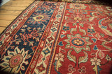 Intricate scrolling Islimis and blooming lotus motifs on the cherry red antique Mahal carpet field.