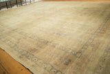 Distressed Kaisary carpet showing etched pile, subtle tone-on-tone design, and muted ivory.