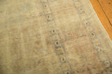 Distressed vintage Kaisary carpet texture with subtle design and etched ivory, gold tones.