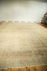 Distressed Turkish Kaisary carpet with etched foundation, featuring faded ivory, gold, and silver tones.