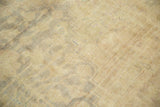 Texture of distressed Kaisary carpet showing etched foundation and subtle gold ivory tones.