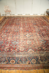 Vintage Persian Mahal border with traditional floral motifs and tattered ends.