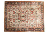 Antique Sultanabad carpet, ivory allover floral field, multi-color accents, navy border.