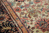 Madder red palmettes, blue tendrils on ivory field and navy border antique Sultanabad carpet.