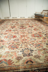 Antique Sultanabad rug's ivory field featuring large floral motifs and delicate tendrils.