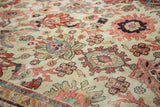 Hand-knotted Sultanabad rug texture, ivory field, splayed palmettes, and delicate red, blue, green florals.