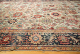Border detail of the antique Sultanabad carpet, showing navy ground and splayed madder red palmettes.