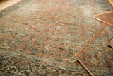 Faded terra cotta and multi-colored gol farang vinery on a distressed Mahal carpet.