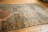 Traditional Persian Bakhtiari rug detail, blue, ivory, and brown panel motifs with fringe.