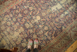 Antique Karabagh rug with prominent wear, showcasing Herati mahi design.
