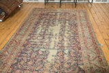 Antique Karabagh runner detail: red serrated leaf border and navy Herati mahi field with lightened areas.