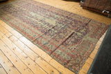 Worn corner of a late 19th century Karabagh runner, displaying Herati motifs and serrated leaf border.