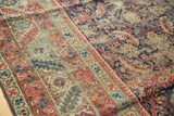 Detailed view of antique Karabagh runner's nuanced Herati motifs and red, navy border, showcasing rich patina.