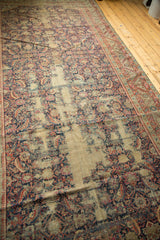Antique Karabagh runner, extensive wear exposing foundation, with faded navy, red, and ivory Herati motifs.