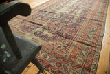 Intricate Herati pattern, serrated leaf border, and wear on antique Karabagh runner.