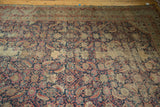 Antique Karabagh runner detail, highlighting faded navy, madder red Herati mahi motifs with wear.