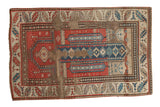 Antique Caucasian prayer rug with geometric patterns, human figures, red, blue, ivory. Visible rewoven areas.