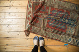Hand knotted antique Caucasian prayer rug showing geometric patterns, stylized human figures, rewoven foundation.