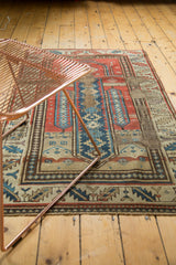 Visible rewoven foundation and geometric border of antique Caucasian prayer rug.